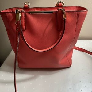 Coach textured leather coral red/orange handbag and crossbody bag.